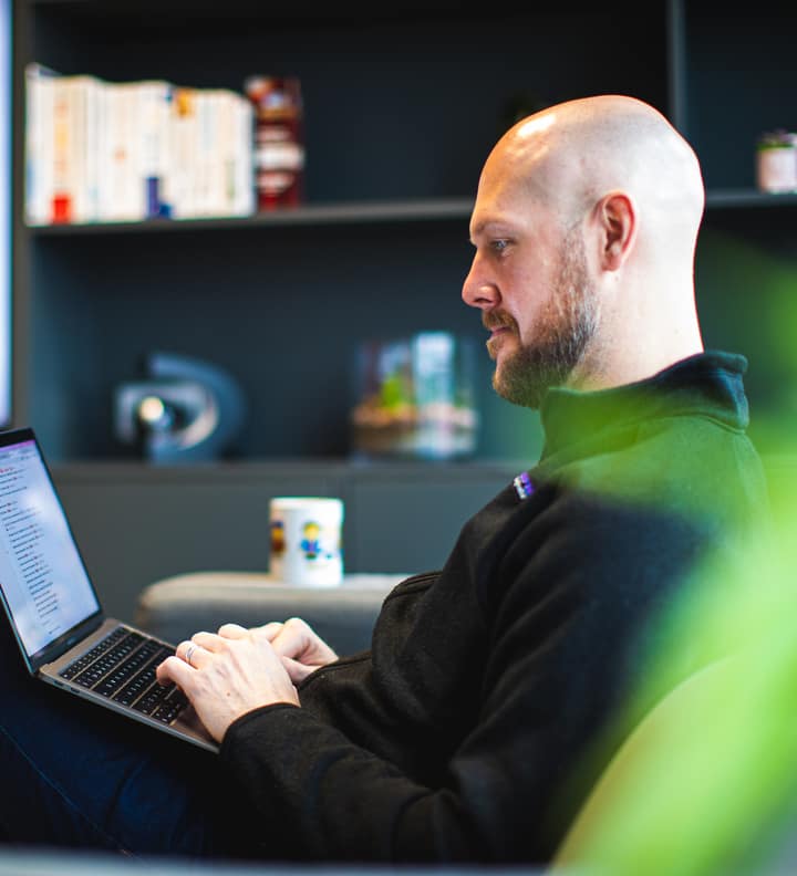 Liam O'Leary, Managing Director of Laser Red, working in the Laser Red office